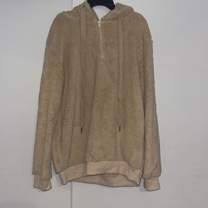 Beige colored fuzzy quarter zip hoodie